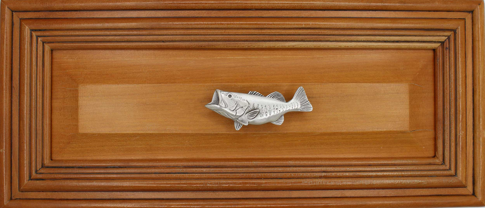 Left facing Bass knob installed on wood drawer - full view