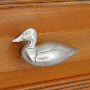 Left facing Mallard Knob installed on wood drawer - angled view