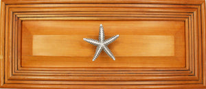 Medium starfish knob installed on wood drawer - full view