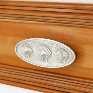 Triple Scallop Seashell Pull installed on wood drawer - angled view