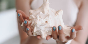 Photo by Content Pixie: https://www.pexels.com/photo/woman-holding-conch-shell-2836943/