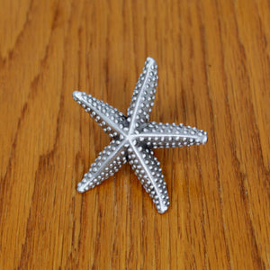 Small Starfish Cabinet Knob on wood