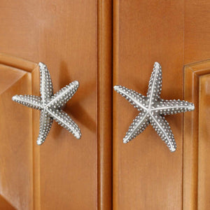 Starfish cabinet knob pair installed on set of cabinet doors