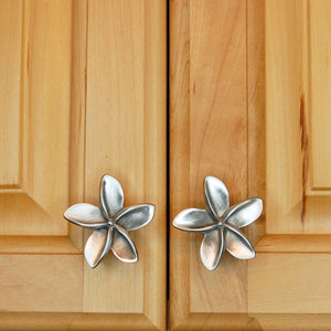 PLumerias knobs install on cabinet doors