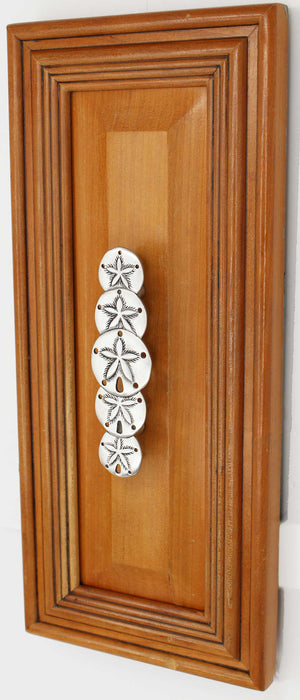 Vertical sand dollar cabinet hand installed on cabinet door