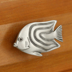 Left facing Angelfish knob installed on wood drawer - angled view