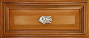 Left facing Angelfish knob installed on wood drawer - full view