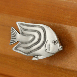 Right facing Angelfish knob installed on wood drawer - angled view