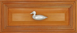 Left facing Mallard Knob installed on wood drawer - full view