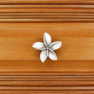 Plumeria knob installed on wood drawer - square view