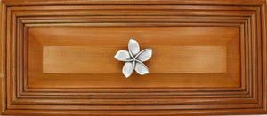 Plumeria knob installed on wood drawer - full view