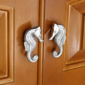 seahorse cabinet knob matched set installed on wood cabinet doors