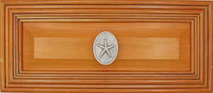 Starfish knob installed on wood drawer - angle view