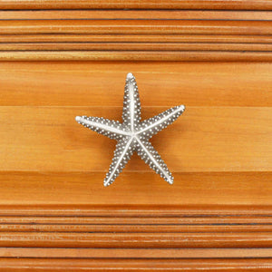 Medium starfish knob installed on wood drawer - square view
